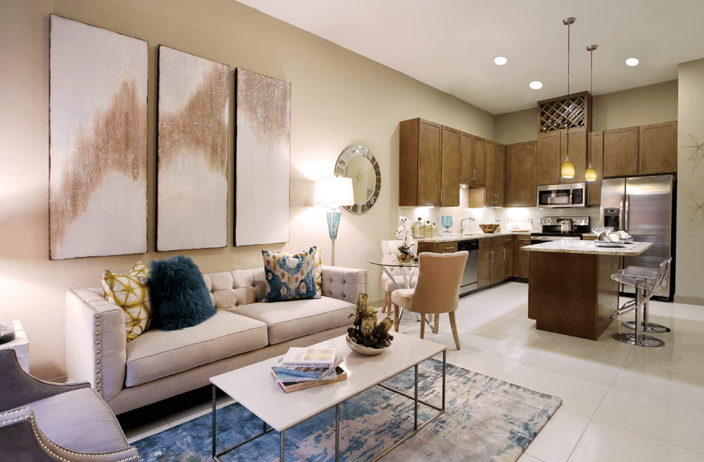 Luxury apartments in Bloomington Minnesota with spacious floor plan, granite countertops, stainless steel appliances, built-in wine rack, kitchen island, and porcelain tile floor at Luxembourg Apartments