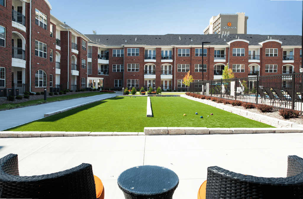 Luxury apartments with bocce ball court, brick exteriors and manicured gardens at Luxembourg Apartments in Bloomington Minnesota