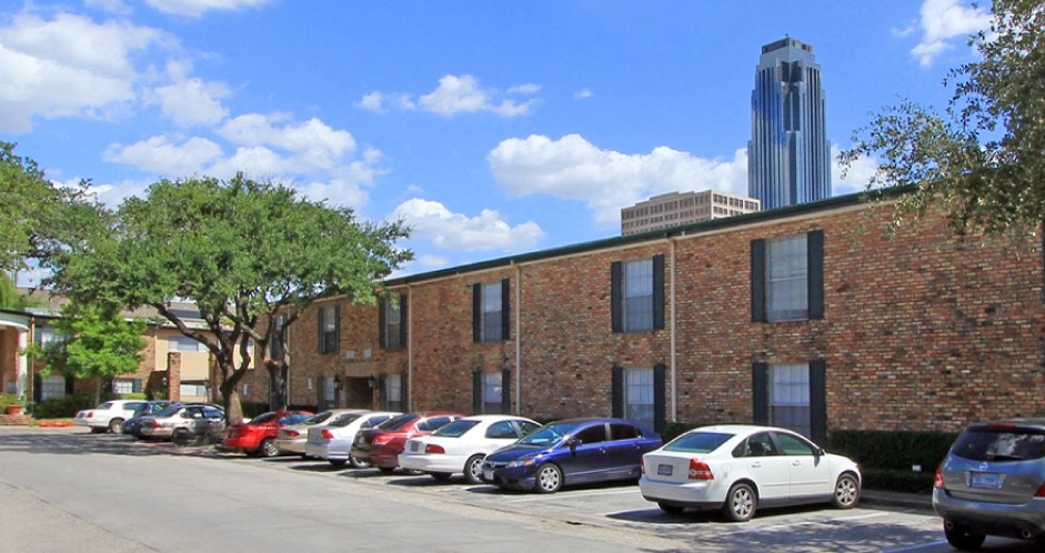 Apartments near the Galleria with brick exteriors, covered parking and courtyard setting at Plantation apartments in Houston.