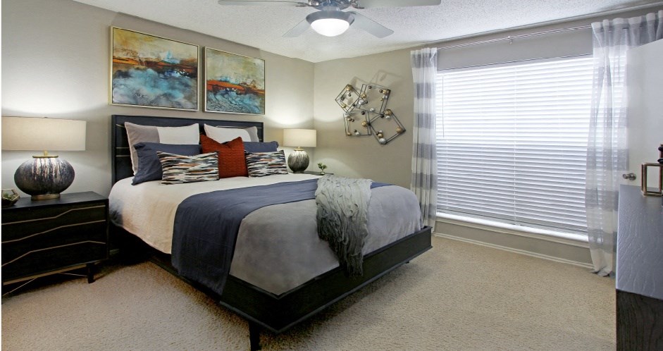 Spacious bedroom that can fit a king size bed with walk-in closet and attached bathroom at Preston Village Apartments in north Dallas