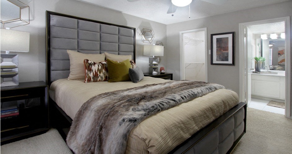 Spacious bedroom that can fit a king size bed with walk-in closet and attached bathroom at Preston Village Apartments in north Dallas