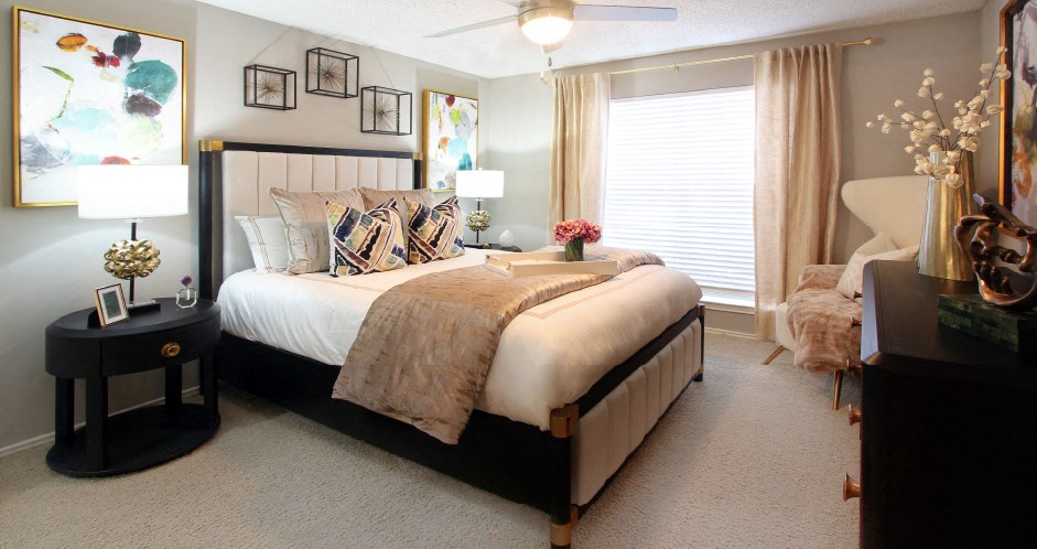 Spacious bedroom that can fit a king size bed with walk-in closet and attached bathroom at Preston Village Apartments in north Dallas