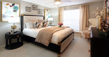 Spacious bedroom that can fit a king size bed with walk-in closet and attached bathroom at Preston Village Apartments in north Dallas - Photo Gallery 17