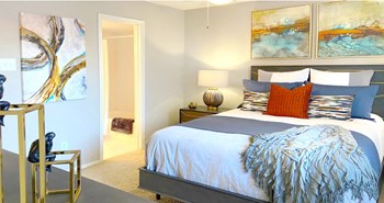 Spacious bedroom that can fit a king size bed with walk-in closet and attached bathroom at Preston Village Apartments in north Dallas - Photo Gallery 31