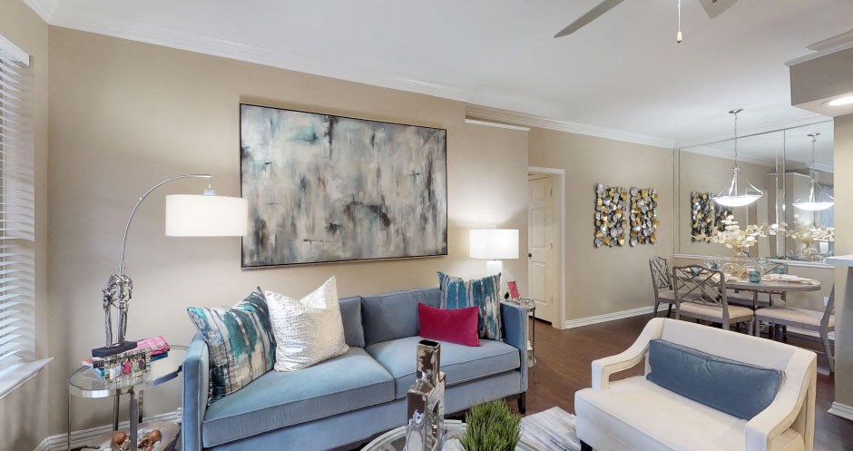 Luxury apartments with wood plank floors, and mirror accent wall at The Saxony Apartments