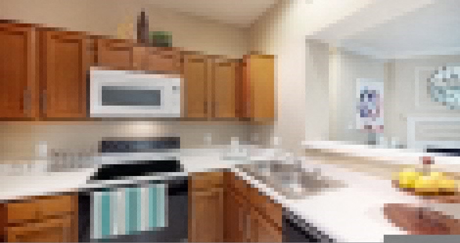 Luxury apartments with spacious kitchens, custom home cabinets, and breakfast bars at Tuscany Gate Apartments in Houston.