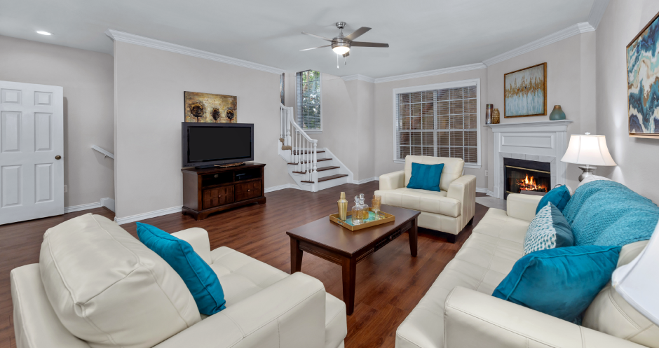Spacious living room with wood-burning fireplace, huge living room at Tuscany Row Townhomes in Houston.