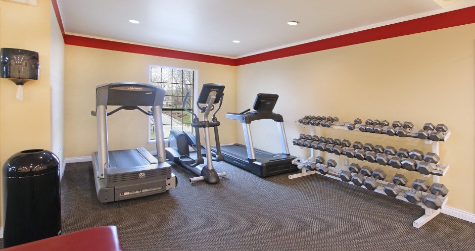 Fitness center with cardio equipment and weights at the Vanderbilt Apartments in Omaha, Nebraska