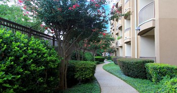Luxury apartments next to the Galleria in Dallas with beautiful landscaping and spacious balconies at Villa Piana Apartments in Dallas - Photo Gallery 11