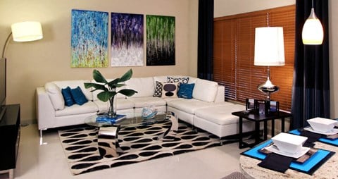 a living room with a white couch and a table