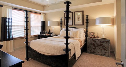Luxury apartments with master bedroom to fit a king size bed, attached master bathroom and walk-in closet at Villa Piana Apartments in Dallas