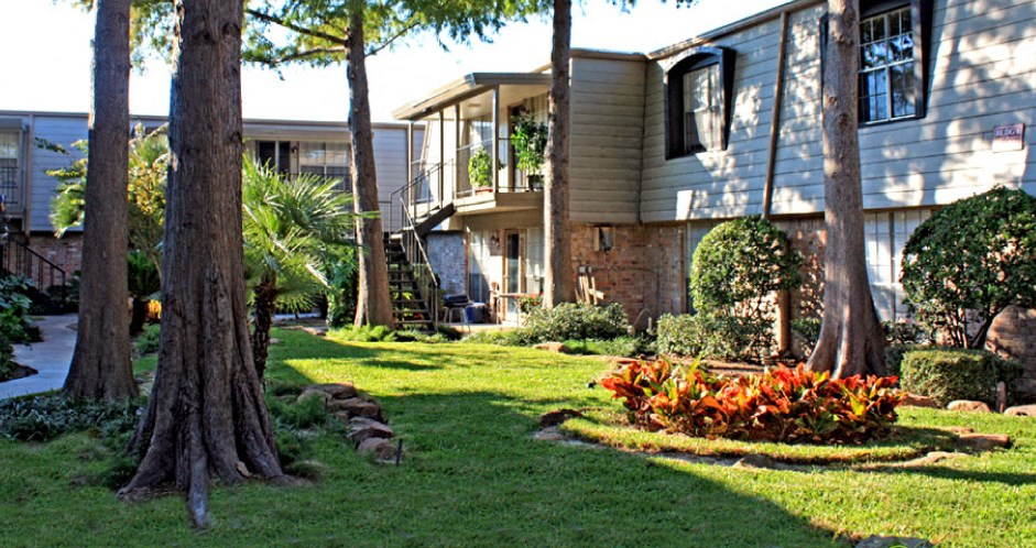 Gated apartment community close to the Galleria with pool, spa, poolside lounge chairs, lush landscaping, beautiful landscaping, and neighborhood setting.