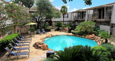Gated apartment community close to the Galleria with pool, spa, poolside lounge chairs, lush landscaping, beautiful landscaping, and neighborhood setting.