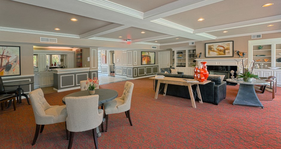 Huge clubhouse with spacious resident lounge, free wi-fi, and fitness center at Woodlake Oaks Apartments in Houston.
