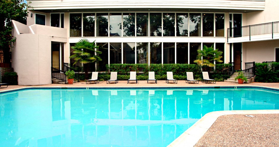 Gated apartments with 4 swimming pools, convenient bayou location and scenic views at Woodlake on the Bayou Apartments in Houston.
