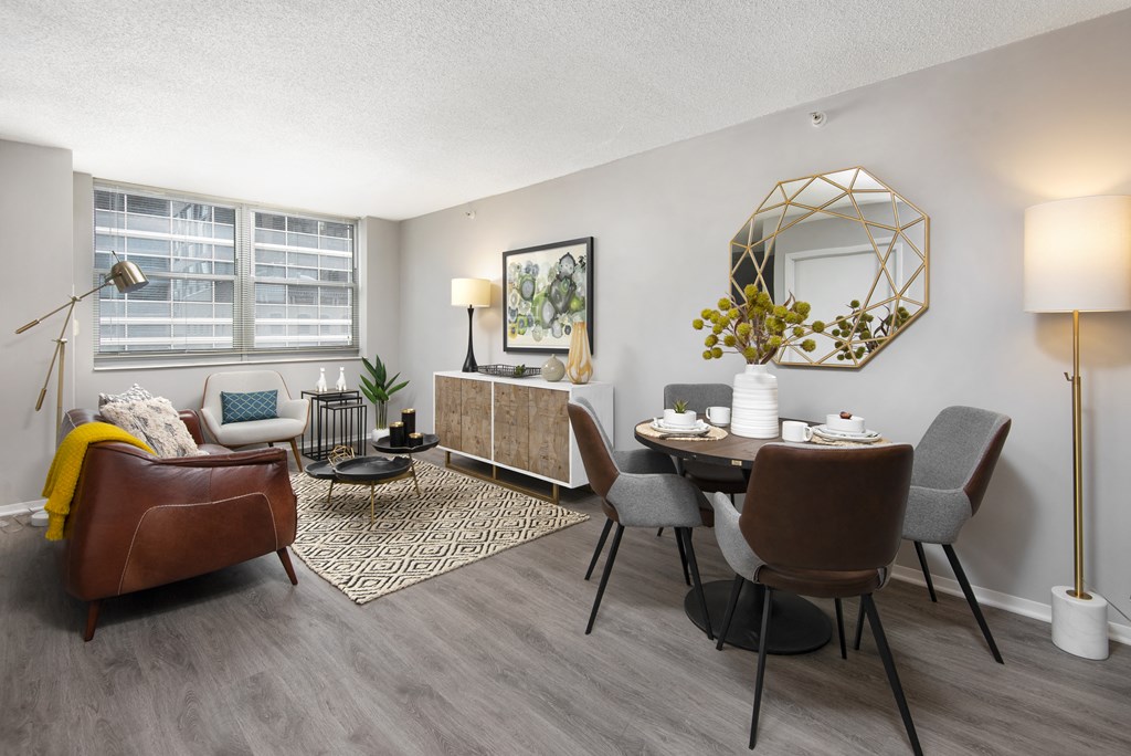 our apartments offer a living room and dining room with a table and chairs