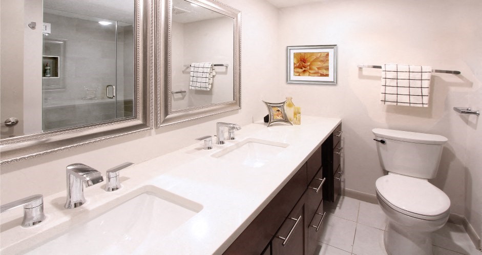 a bathroom with a sink toilet and a mirror