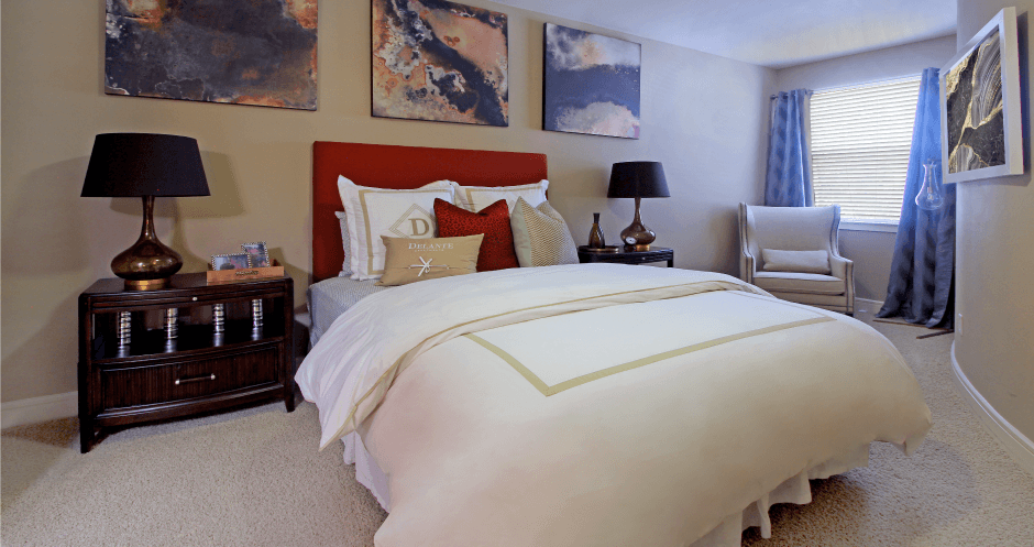 Bedroom with walk-in closet and 10-foot ceilings at Delante Apartments