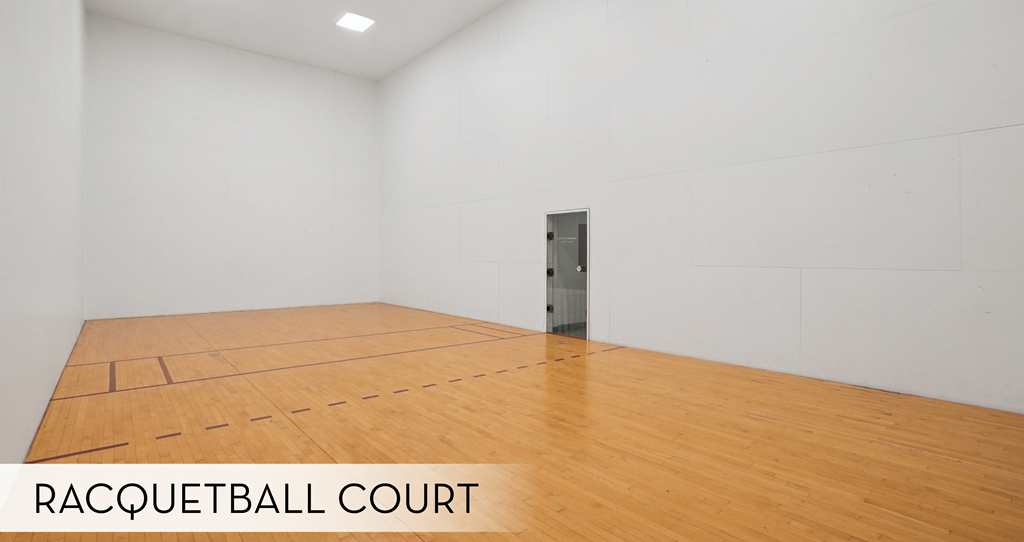A racquetball court with a wall mounted air conditioning unit.