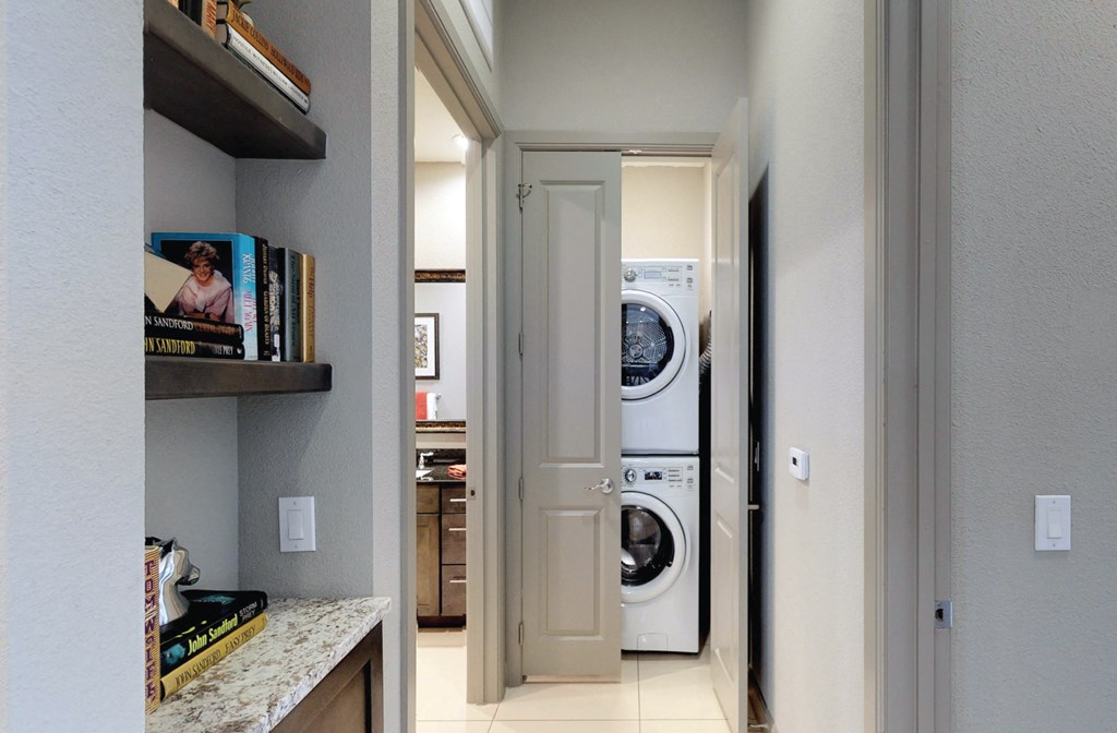 Luxury apartments with stacked font loading washer and dryer at Le Palais Apartments in Houston.