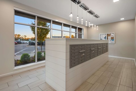 A reception area with a large window overlooking a parking lot.