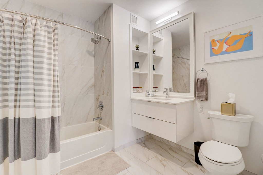 Bathroom with a white sink a at The Apartments at Lincoln Common, 60614