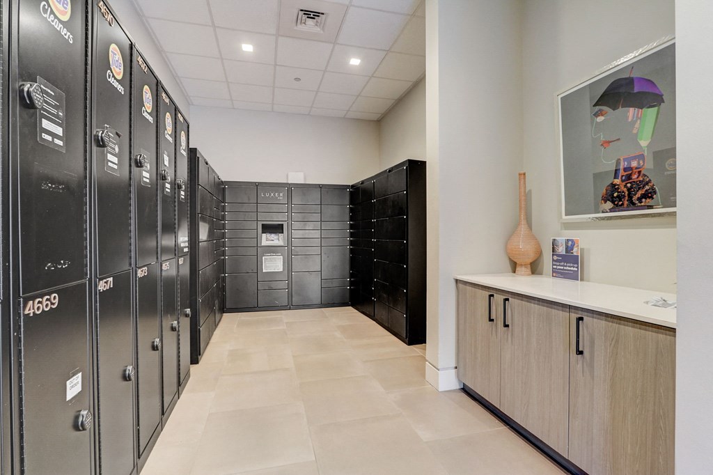 Lockers area in a locker room with a counter and a vase at The Apartments at Lincoln Common, Chicago, IL