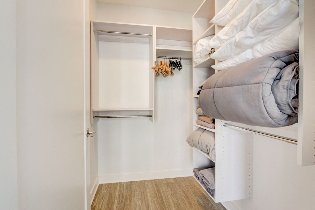 Bedroom with a bunk bed and a closet at The Apartments at Lincoln Common, Chicago, 60614