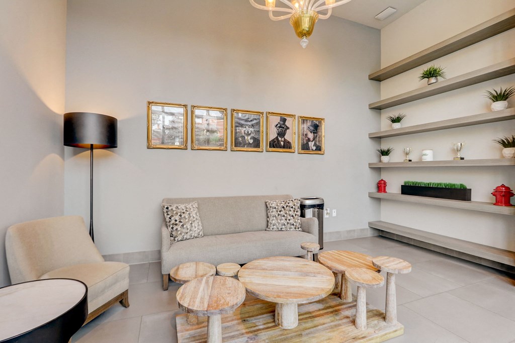 Living room with a sofa and coffee table at The Apartments at Lincoln Common, Chicago