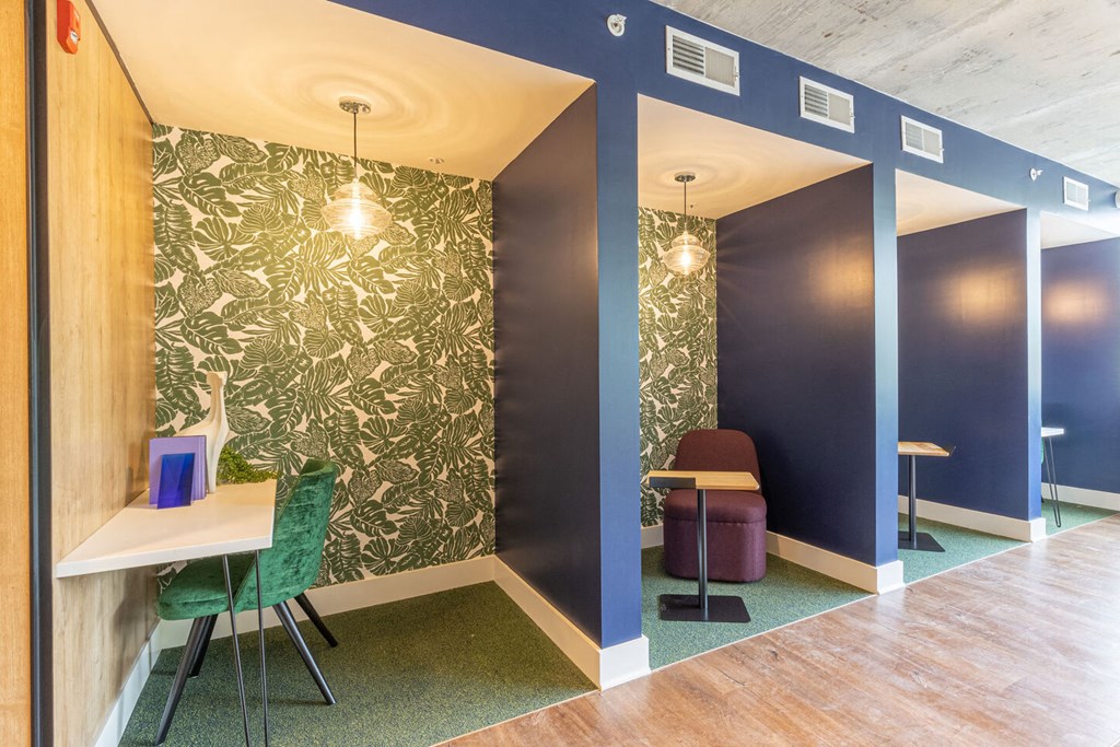 a conference room with blue walls and a table and chairs