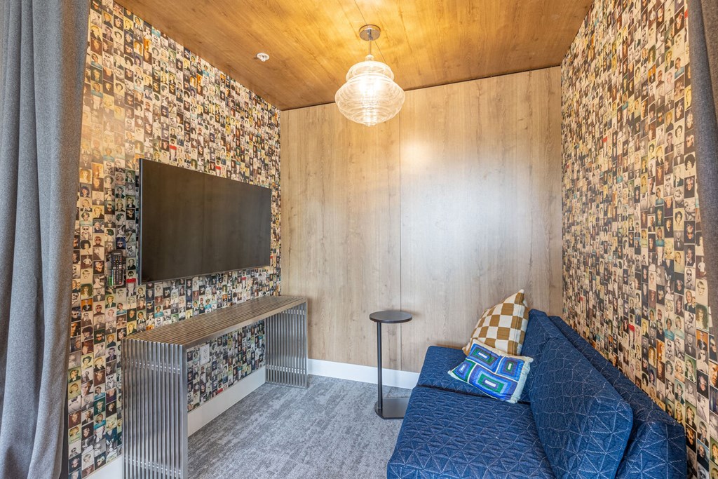 a small living room with a couch and a television