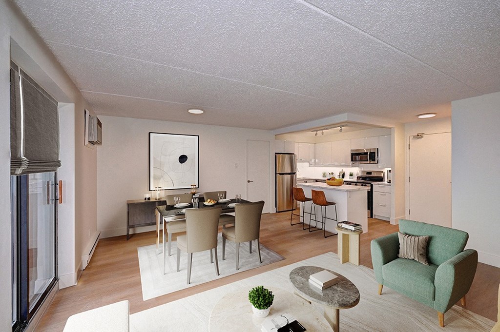 a view of a living room with a kitchen and a dining room
