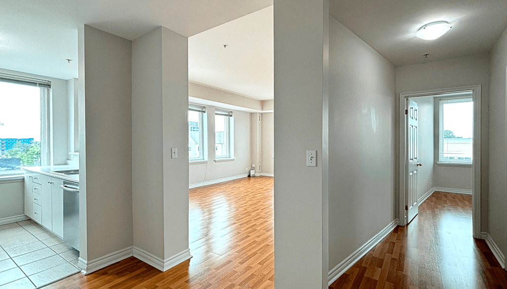 A room with wooden floors and white walls.