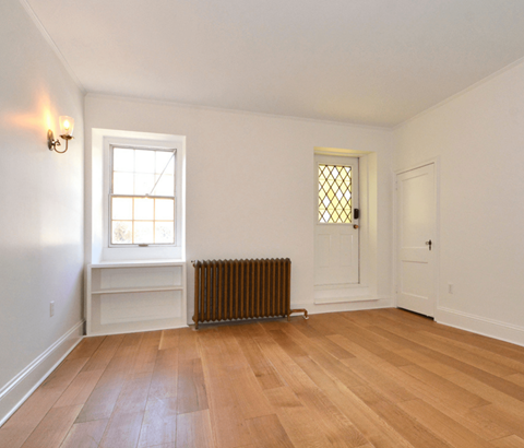 A room with a window and a door.
