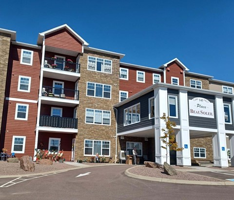 The image shows a multi-story building with the name "Place Beaulieu" on the front.