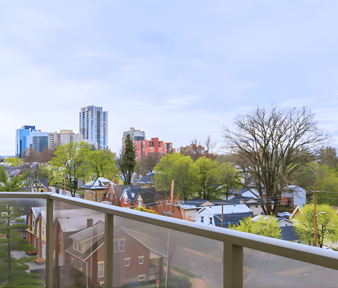 A view of a residential area with houses and trees.