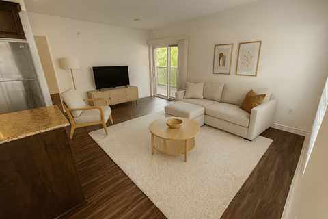 A living room with a white couch and a wooden coffee table.