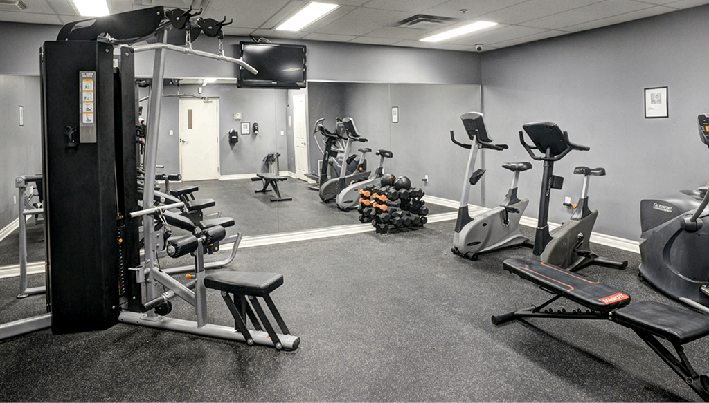 a gym with various exercise machines and weights