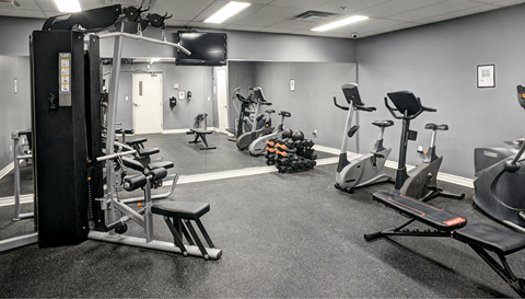 a gym with various exercise machines and weights
