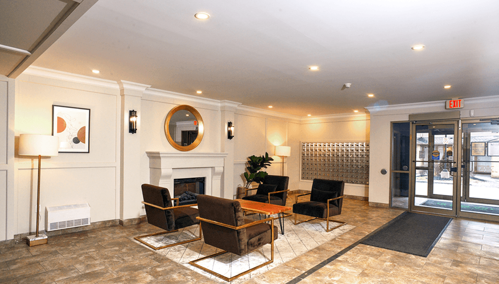 a living room with a fireplace and a glass door