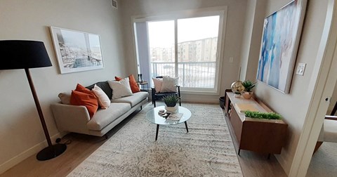 a living room with a couch and a table
