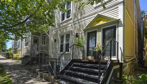 A house with the number 6087 on the front.