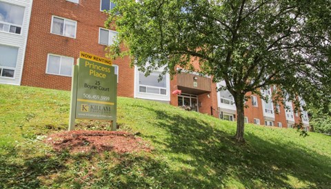 a sign in front of a brick building