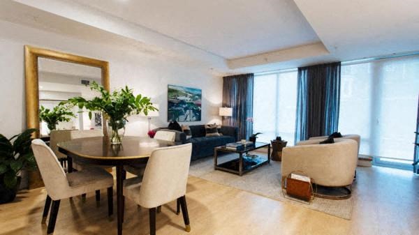 a living room with a table and a couch