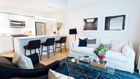 a living room with a couch and a bar