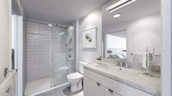 a bathroom with a sink toilet and a shower