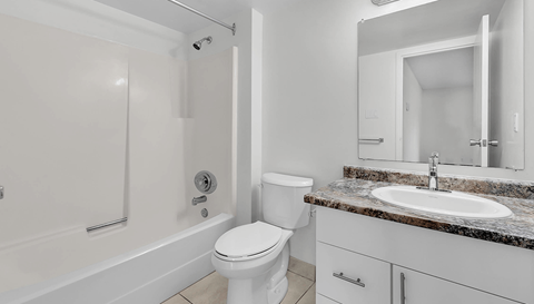 a bathroom with a sink toilet and a shower