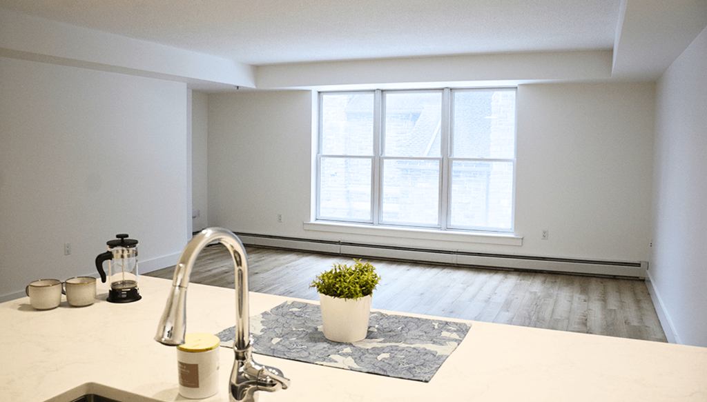 A kitchen with a sink and a window.