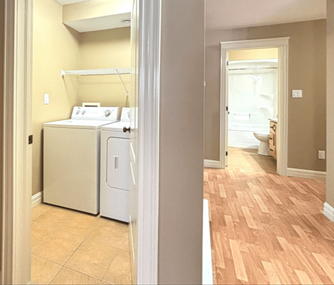 A laundry room with a washer and dryer.