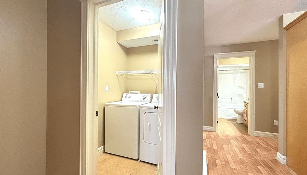 A small room with a washer and dryer in it.